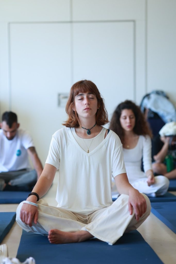 "Participants practicing dynamic meditation at the Dao Therapy detox center in Thailand."