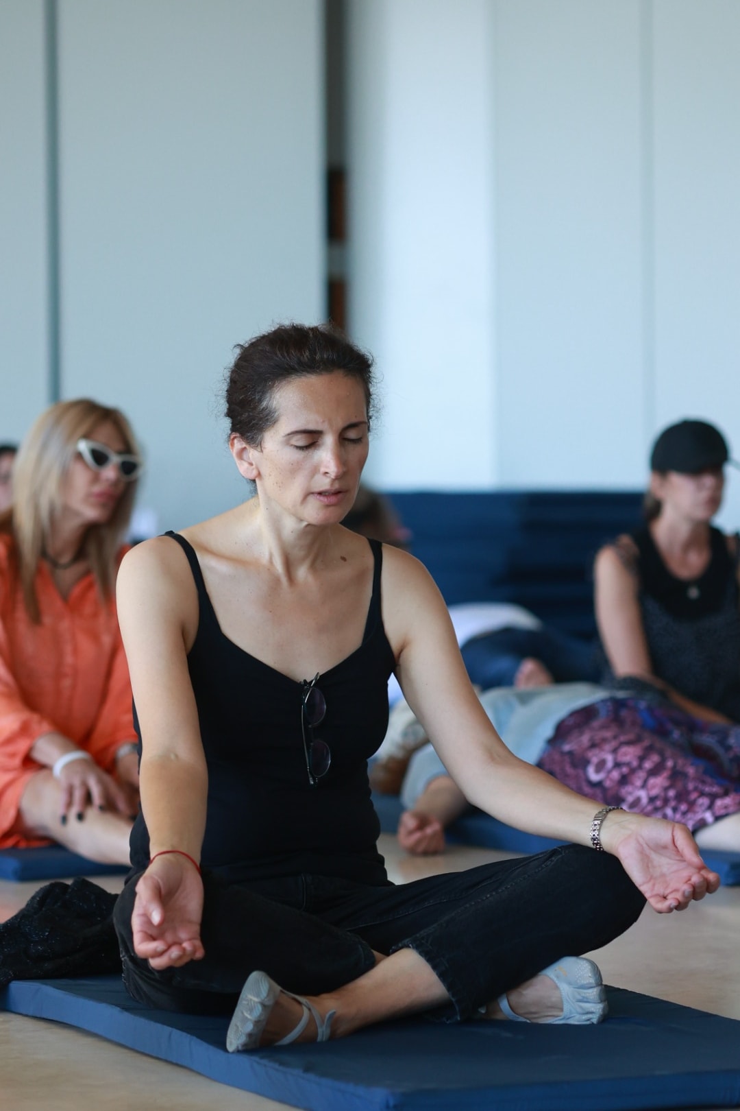 "Participants engaging in Kundalini meditation at a rehab center in Thailand."