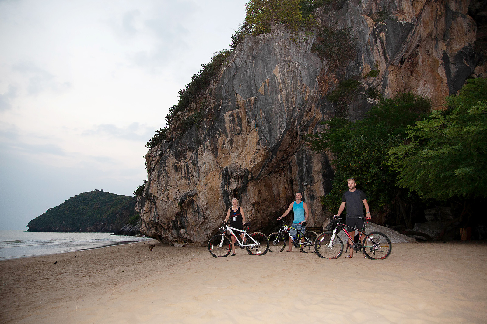 "Participants on a therapeutic bike trek through scenic trails at TaoTherapy Rehab in Thailand."